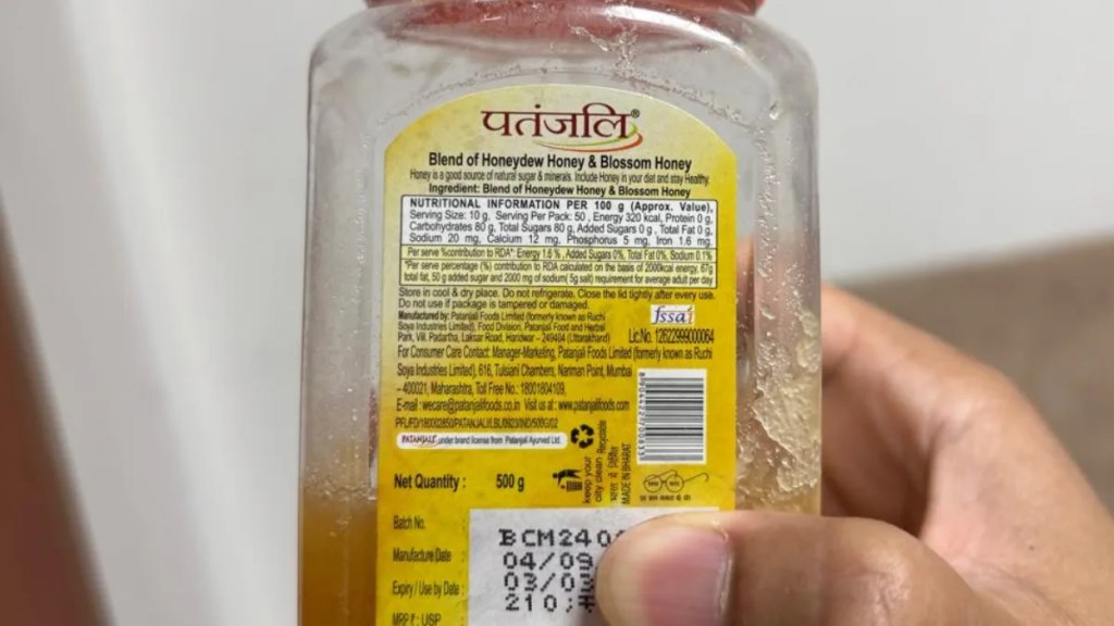 Patanjali honey product label showing batch number, manufacturing date, and FSSAI certification mark